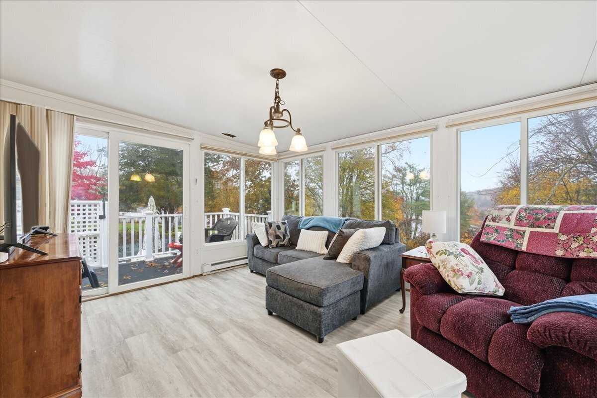 7 Barn Road Ledyard, CT 06339 - Photo 12 of 26 a living room with furniture and a large window