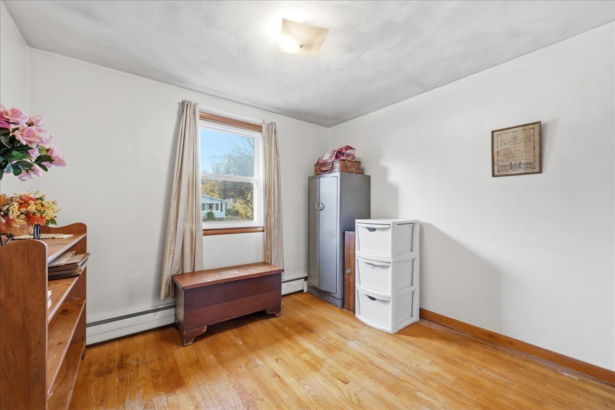 7 Barn Road Ledyard, CT 06339 - Photo 15 of 26 a living room with furniture and a window