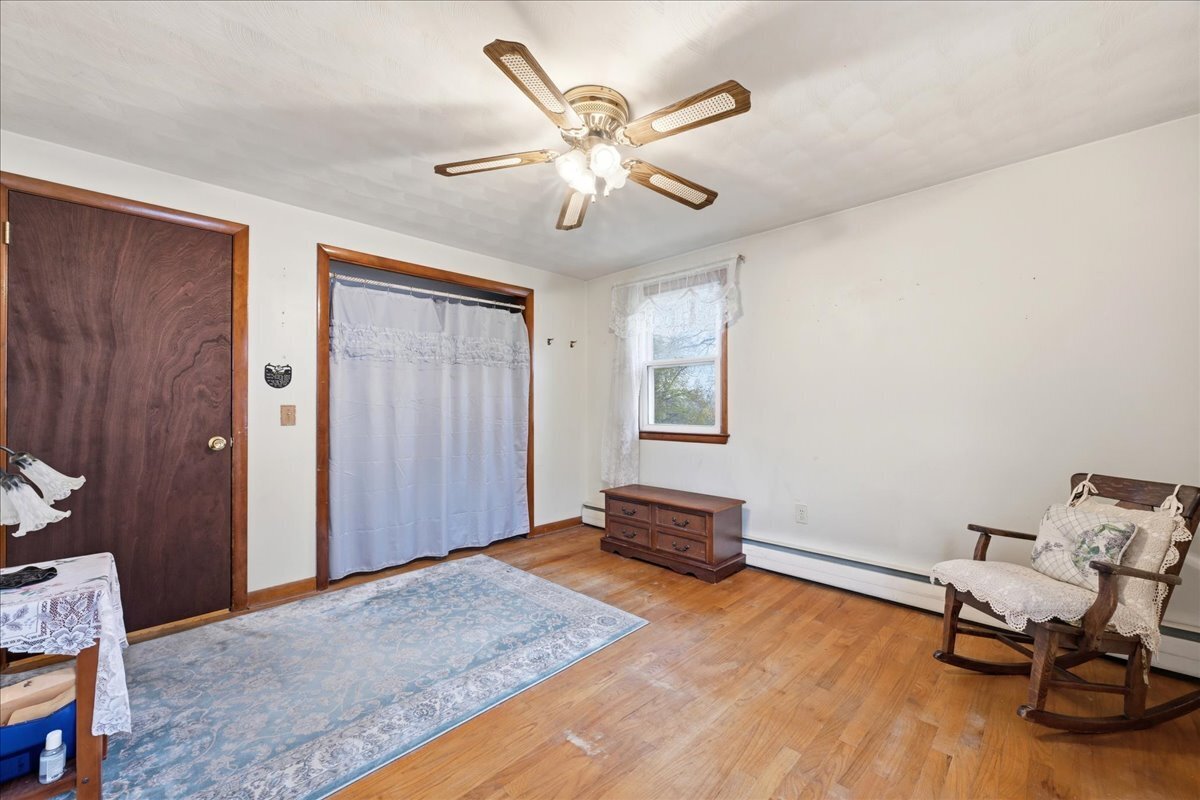 7 Barn Road Ledyard, CT 06339 - Photo 18 of 26 a view of workspace with wooden floor and ceiling fan