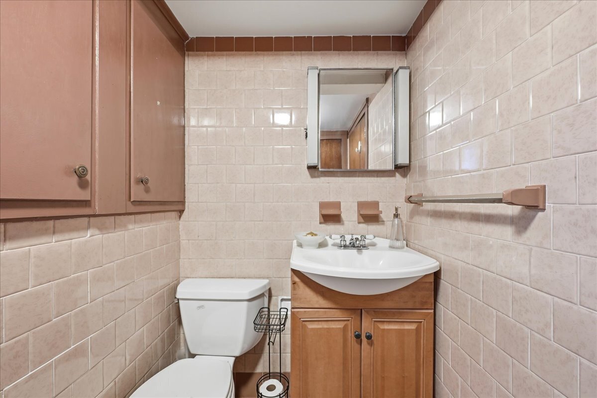 7 Barn Road Ledyard, CT 06339 - Photo 20 of 26 a bathroom with a sink a toilet and mirror