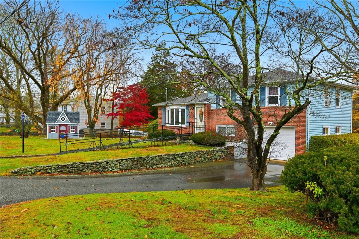 7 Barn Road Ledyard, CT 06339 - Photo 2 of 26 a view of a house with a yard and large trees