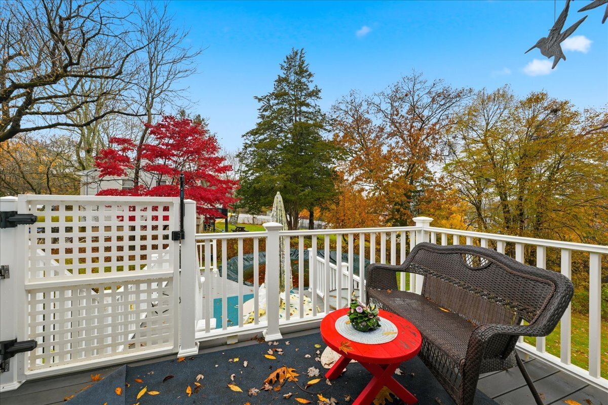 7 Barn Road Ledyard, CT 06339 - Photo 23 of 26 a view of a chairs and table on the deck