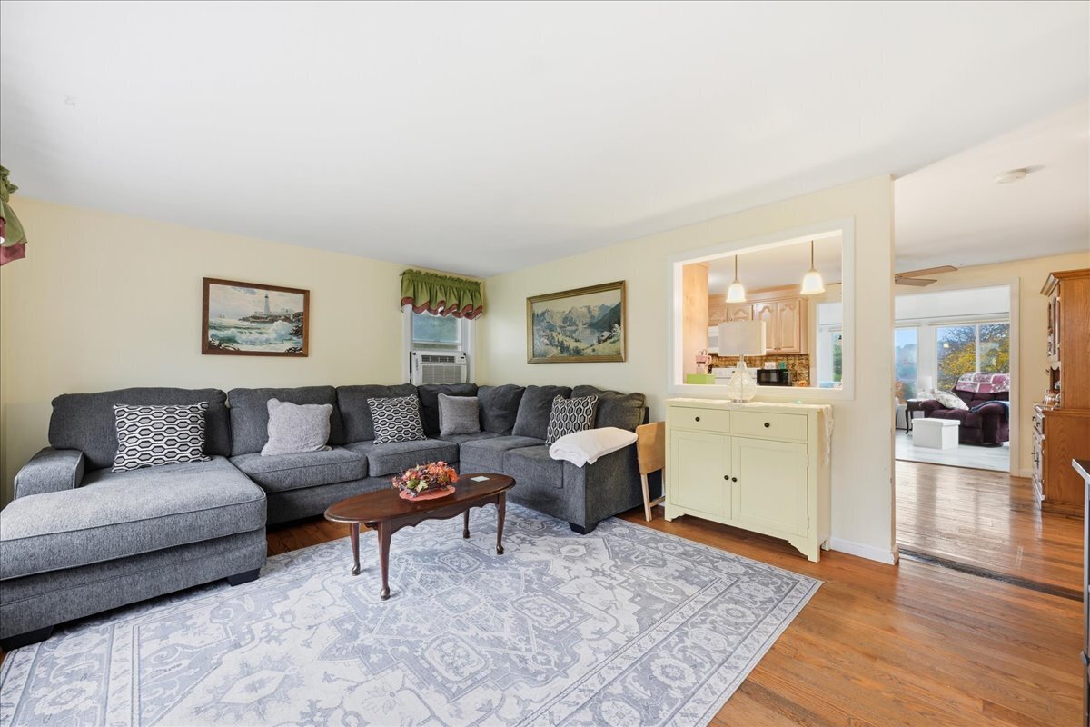 7 Barn Road Ledyard, CT 06339 - Photo 4 of 26 a living room with furniture and wooden floor