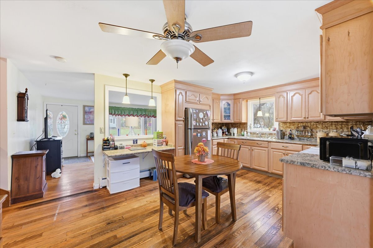 7 Barn Road Ledyard, CT 06339 - Photo 5 of 26 a view of a dining room with furniture window and wooden floor