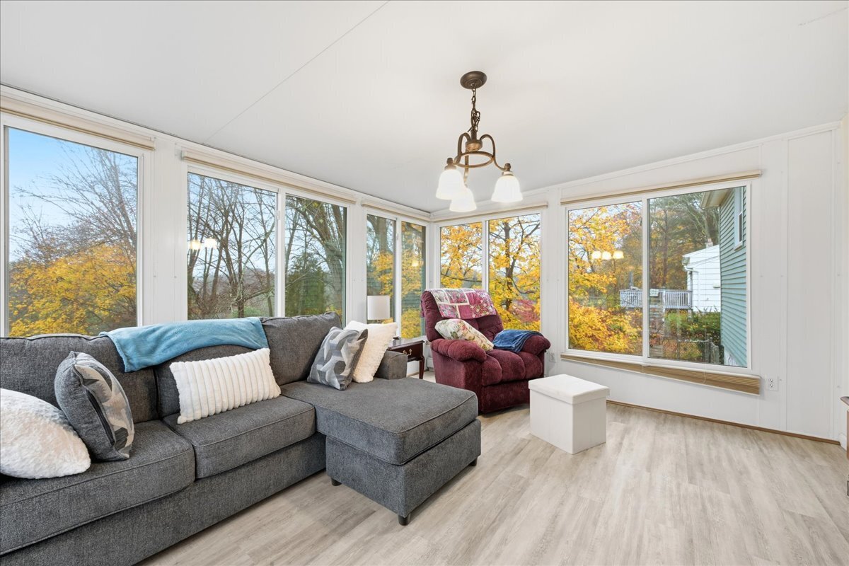 7 Barn Road Ledyard, CT 06339 - Photo 9 of 26 a living room with furniture and a large window