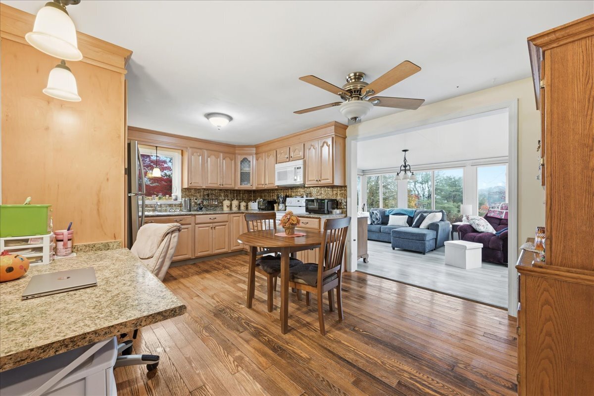 7 Barn Road Ledyard, CT 06339 - Photo 10 of 26 a living room with stainless steel appliances granite countertop furniture and a wooden floor