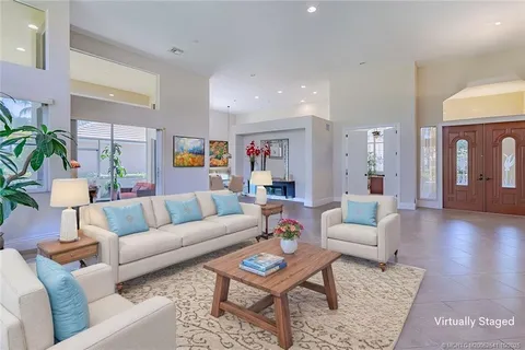 a room with furniture and a potted plant