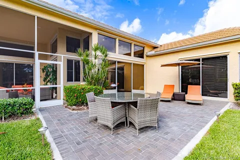 a bathroom with a granite countertop sink a shower and a mirror