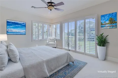 a bathroom with a granite countertop sink mirror and vanity