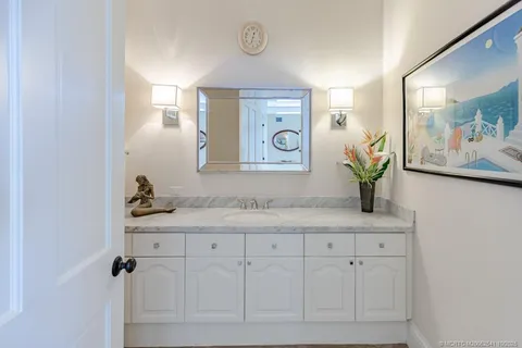 an aerial view of a house with a yard and garden