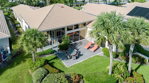 an aerial view of a house with a ocean view