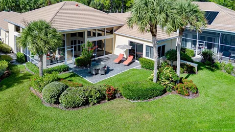 a living room with lots of books
