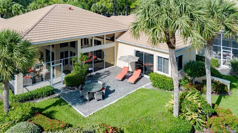 a group of people sitting at tables in a room