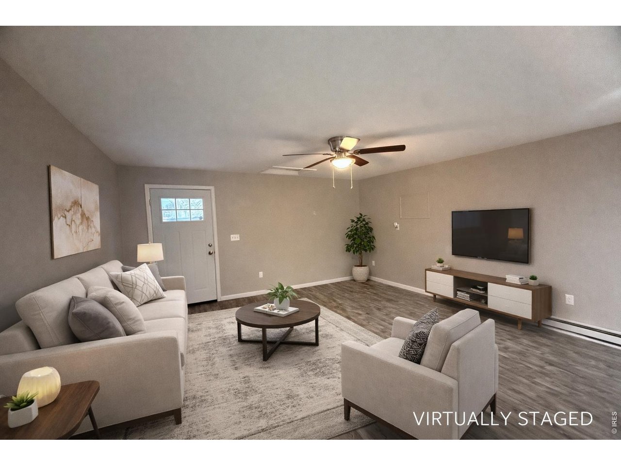 703 North 2nd Street Sterling, CO 80751 - Photo 1 of 19 a living room with furniture and a flat screen tv