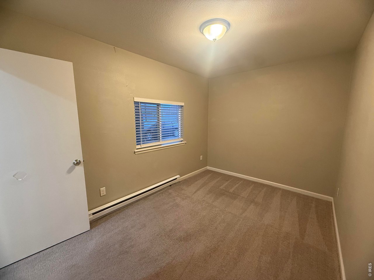 703 North 2nd Street Sterling, CO 80751 - Photo 10 of 19 an empty room with a workbench