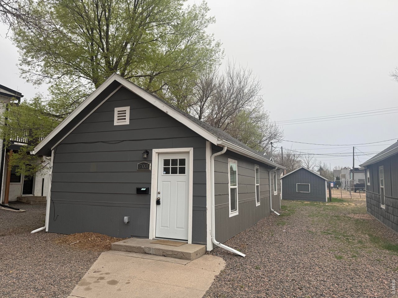 703 North 2nd Street Sterling, CO 80751 - Photo 12 of 19 a view of a house with a yard and garage