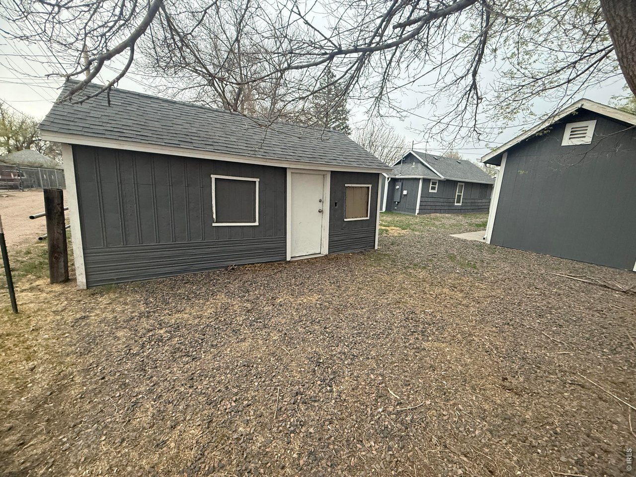 703 North 2nd Street Sterling, CO 80751 - Photo 15 of 19 a house that has a tree in front of it