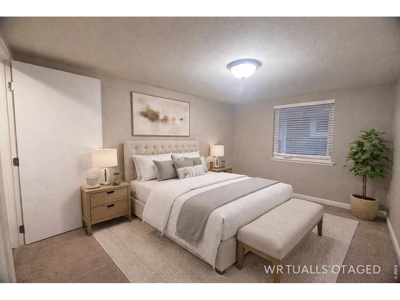 703 North 2nd Street Sterling, CO 80751 - Photo 7 of 19 a bedroom with a bed and a painting on the wall