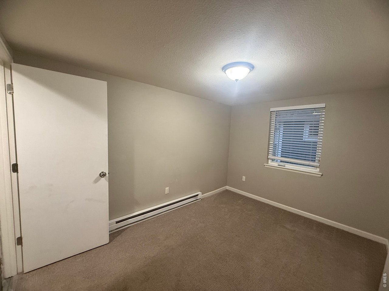 703 North 2nd Street Sterling, CO 80751 - Photo 8 of 19 a view of an empty room with a window