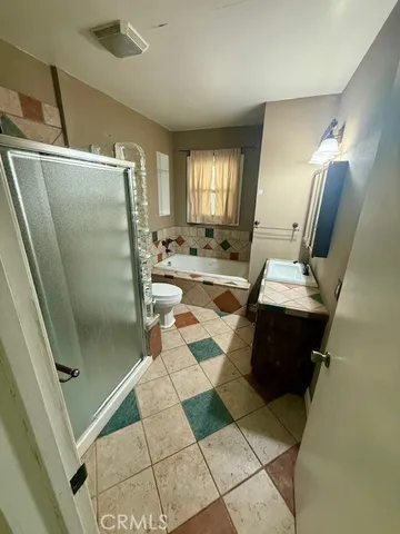 a bathroom with a sink a mirror and a shower