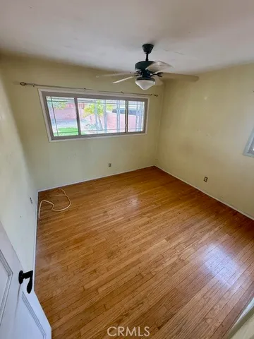 a view of an empty room and a window