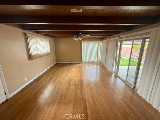 a view of hallway with wooden floor