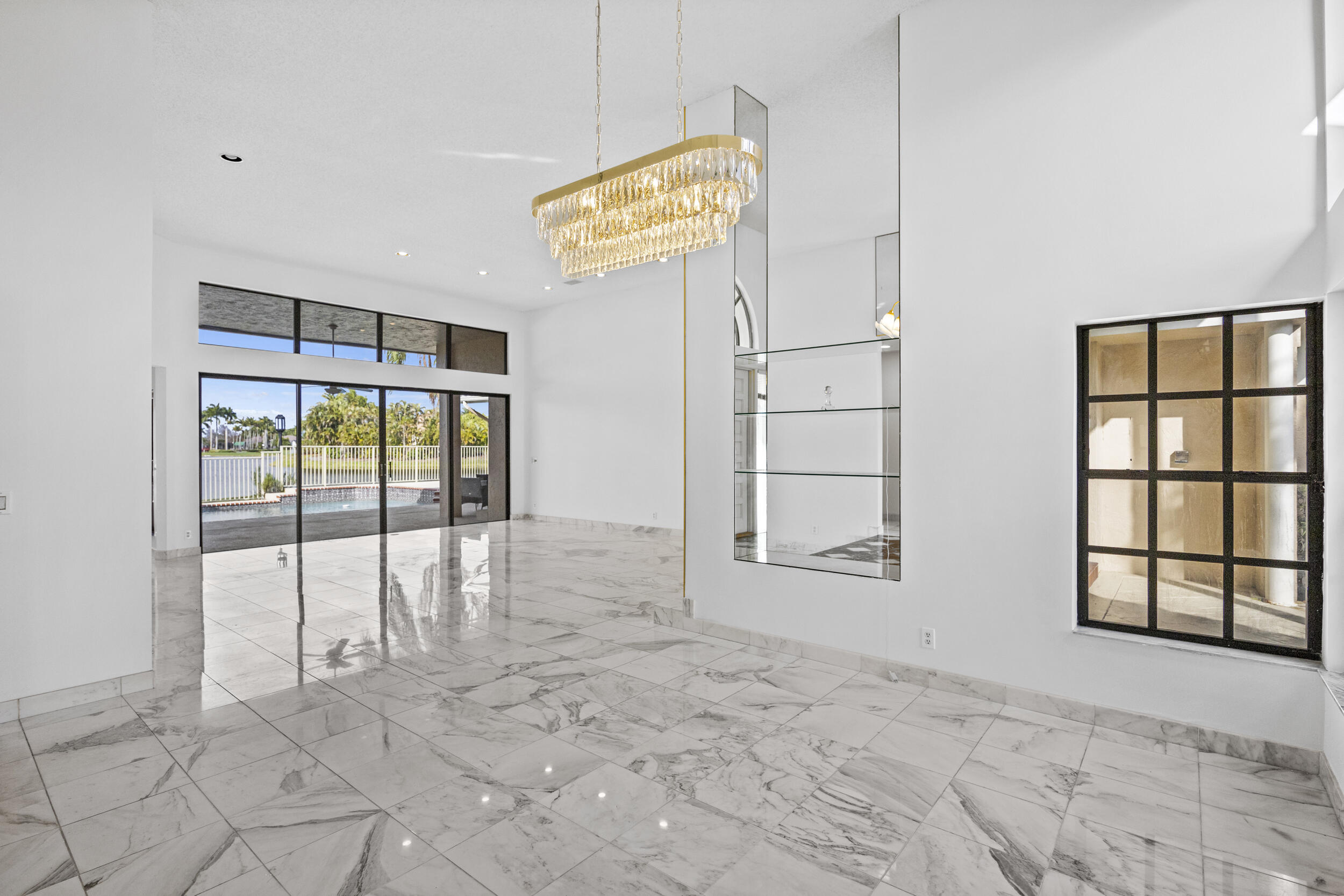 10747 Stonebridge Boulevard Boca Raton, FL 33498 - Photo 14 of 75 a view of an empty room with a window