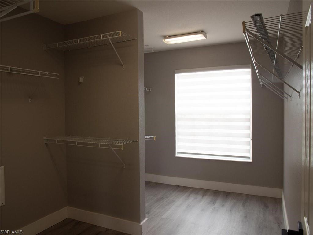 2822 Inlet Cove Lane West Naples, FL 34120 - Photo 11 of 23 a view of a small space with wooden floor and a window