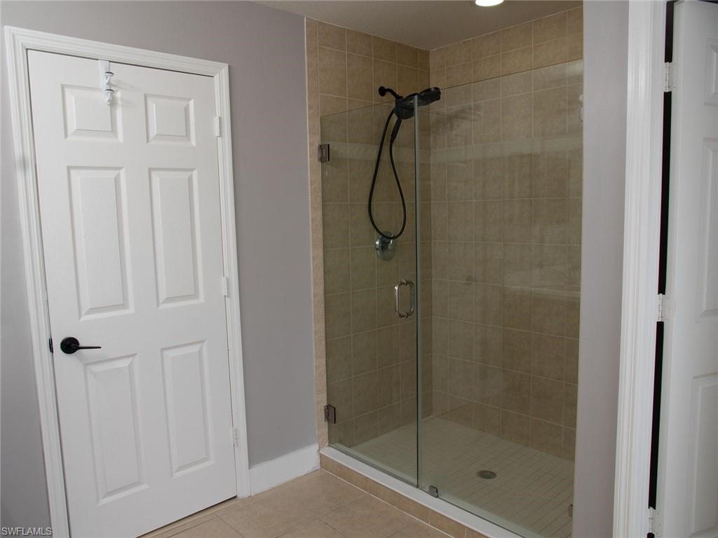 2822 Inlet Cove Lane West Naples, FL 34120 - Photo 18 of 23 a bathroom with a shower