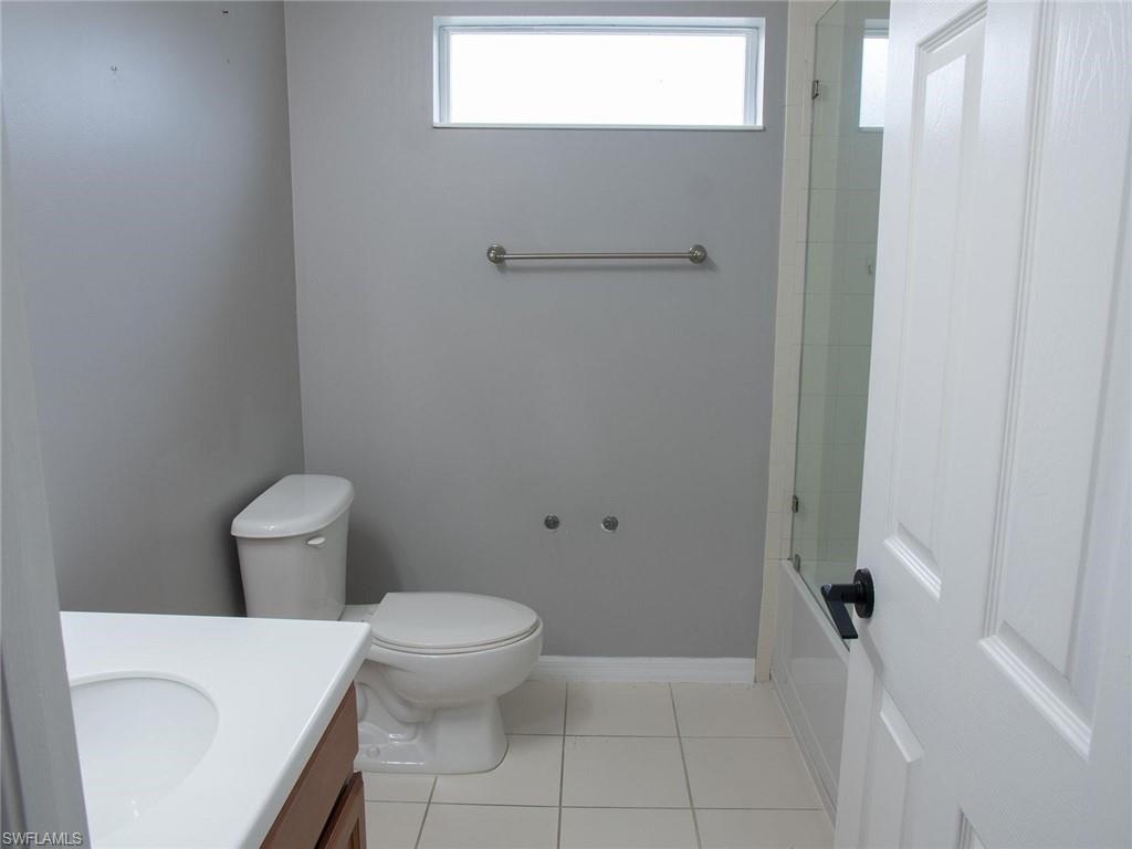 2822 Inlet Cove Lane West Naples, FL 34120 - Photo 19 of 23 a bathroom with a toilet and a shower