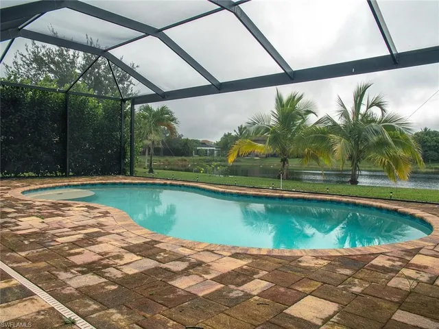a view of swimming pool with a yard