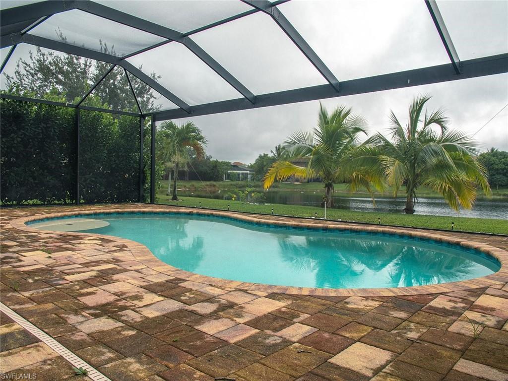 2822 Inlet Cove Lane West Naples, FL 34120 - Photo 21 of 23 a view of swimming pool with a yard