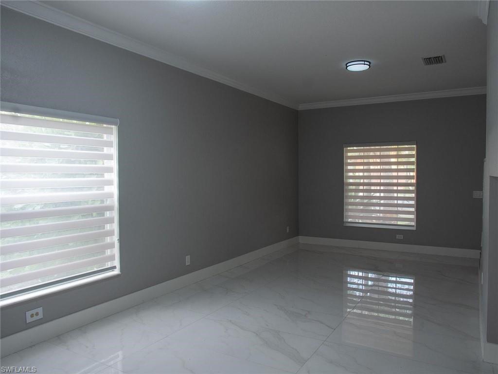 2822 Inlet Cove Lane West Naples, FL 34120 - Photo 9 of 23 a view of an empty room with a window