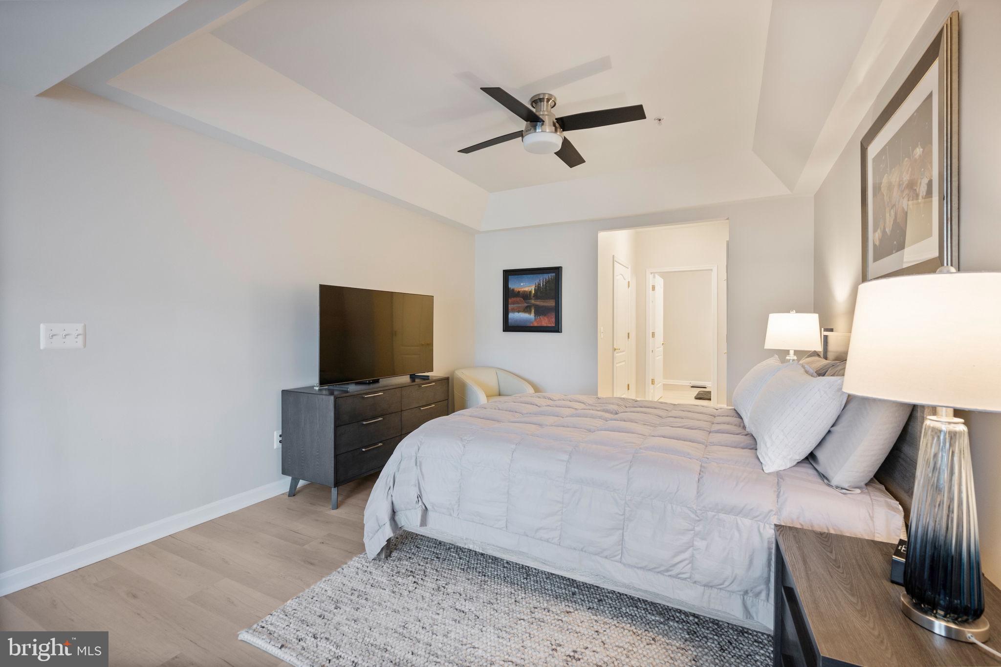 7315 Maplecrest Road, Unit 205 Elkridge, MD 21075 - Photo 17 of 54 a bedroom with a bed and a flat screen tv