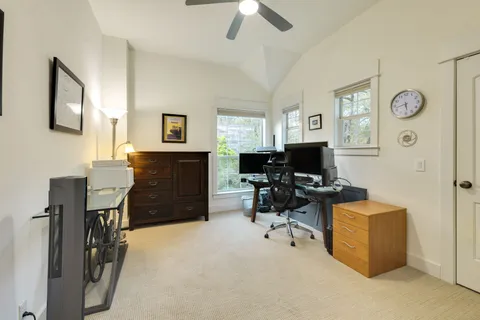 a workspace with furniture cabinet and a window