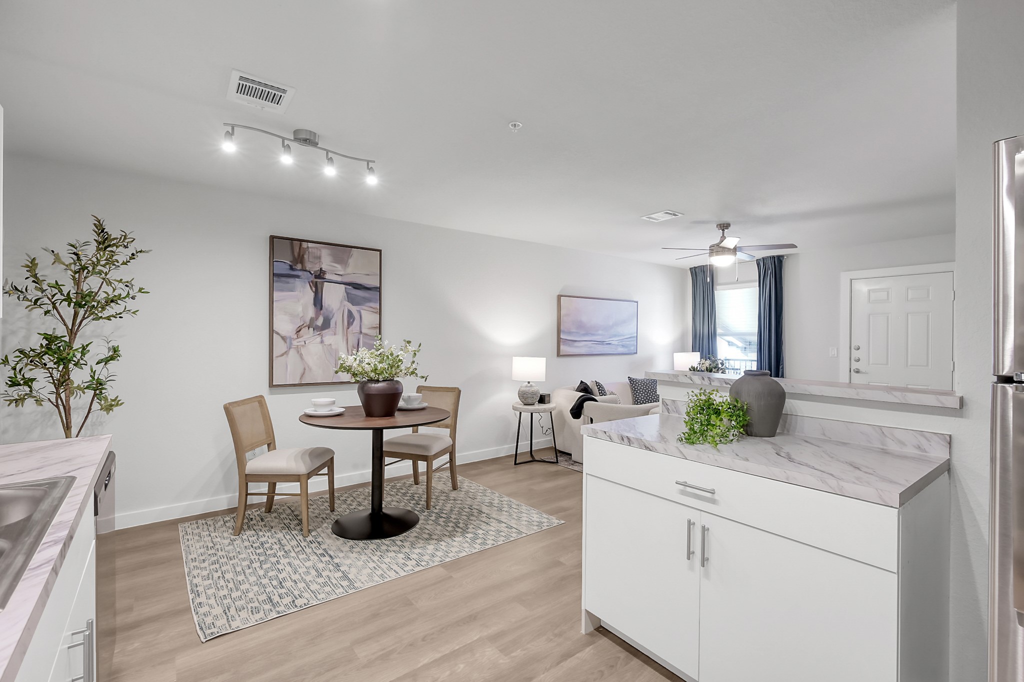 3450 Barker Cypress Road, Unit 2205 Houston, TX 77084 - Photo 13 of 21 a view of a dining room with furniture and wooden floor