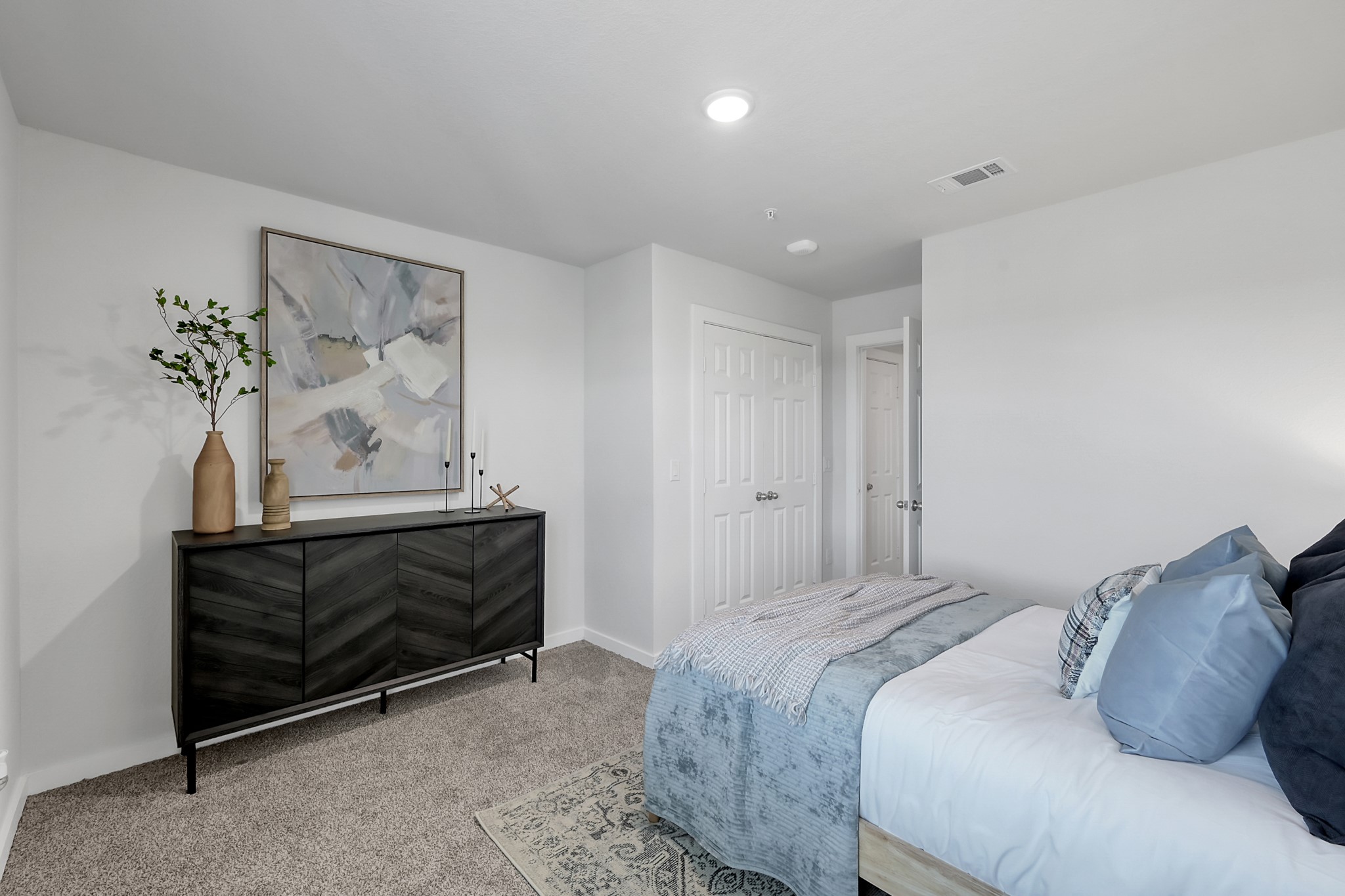 3450 Barker Cypress Road, Unit 2205 Houston, TX 77084 - Photo 15 of 21 a bedroom with a bed and a painting on the wall