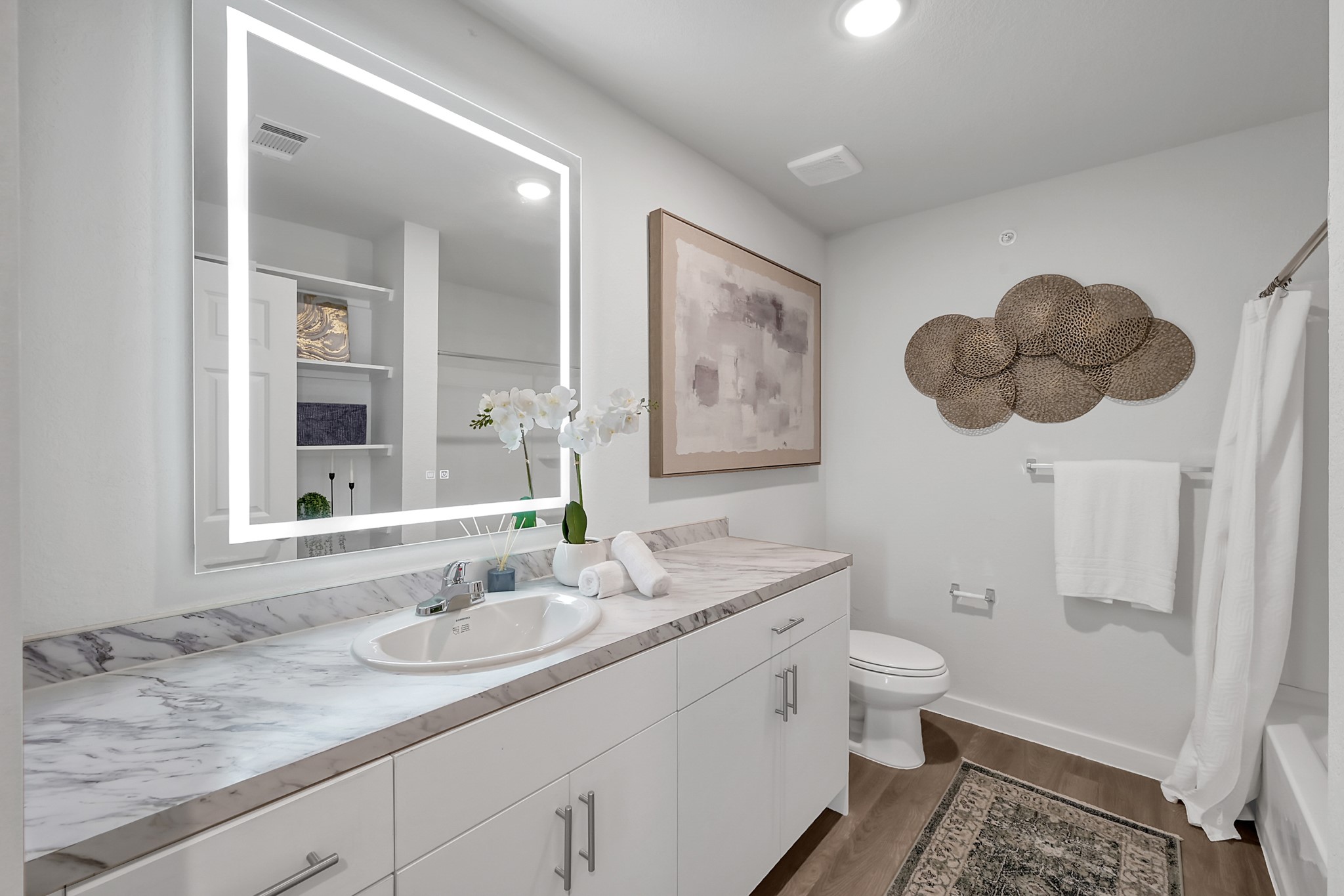 3450 Barker Cypress Road, Unit 2205 Houston, TX 77084 - Photo 16 of 21 a bathroom with a granite countertop sink and a mirror