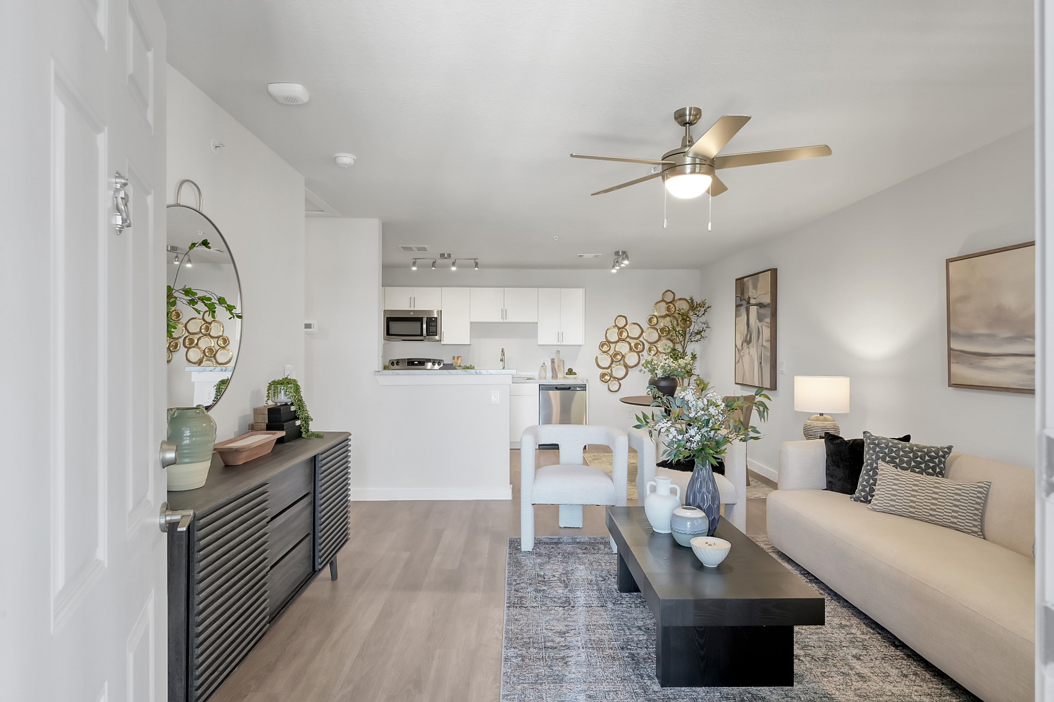 3450 Barker Cypress Road, Unit 2205 Houston, TX 77084 - Photo 2 of 21 a living room with furniture and flowers