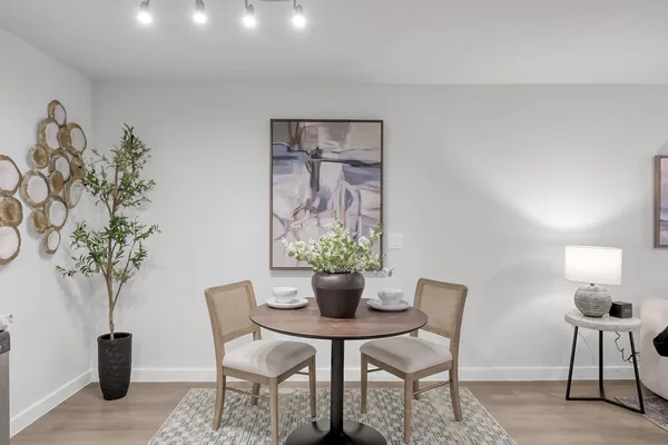 a dining room with furniture and chandelier