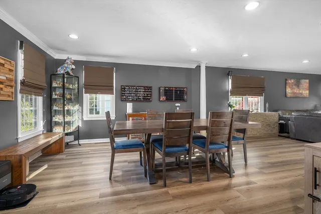 a view of a dining room with furniture window and wooden floor