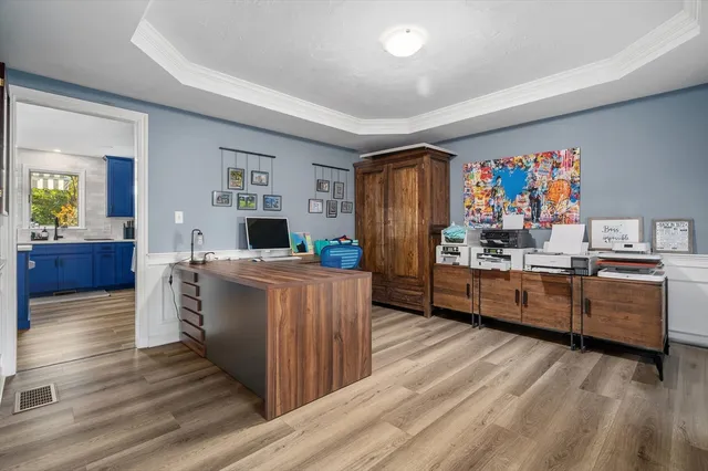 a view of kitchen with furniture and wooden floor
