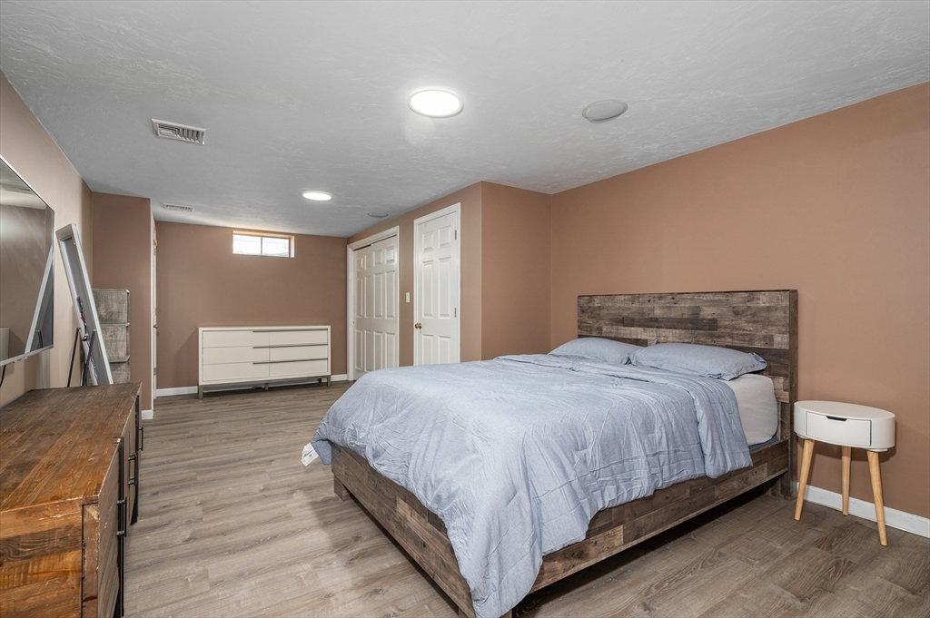 4 Horseneck Road Shrewsbury, MA 01545 - Photo 25 of 33 a bedroom with a bed and a large window