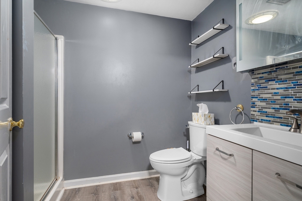 4 Horseneck Road Shrewsbury, MA 01545 - Photo 26 of 33 a bathroom with a sink a toilet and vanity