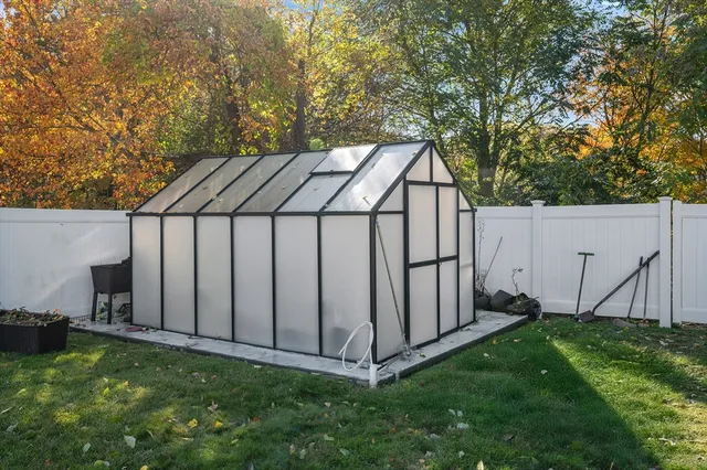 a view of backyard with cabin