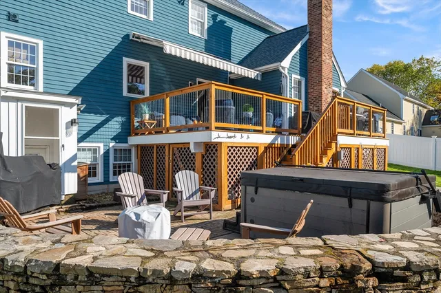 a front view of a house with outdoor seating