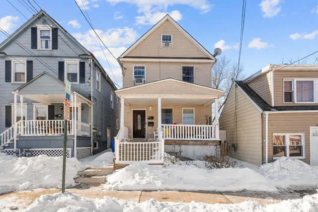 a front view of a house with a yard