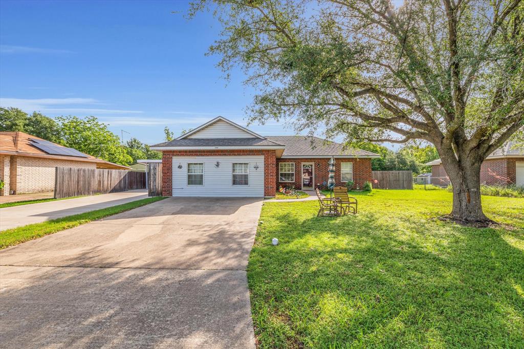 1006 Beaver Street Waco, TX 76705 - Photo 1 of 1 a front view of a house with yard and green space