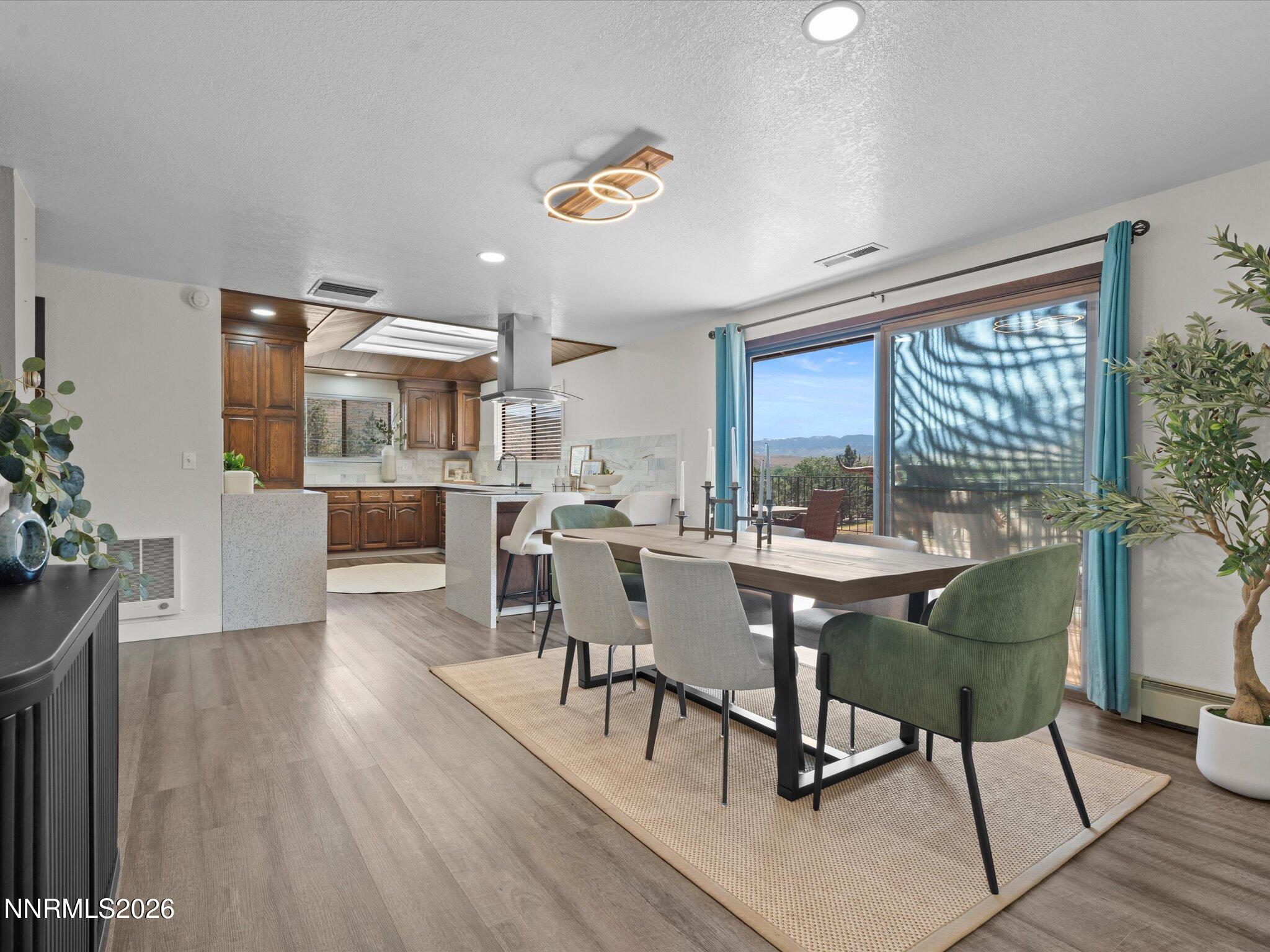 20449 Temelec Way Reno, NV 89521 - Photo 18 of 65 a dining room with furniture window and wooden floor