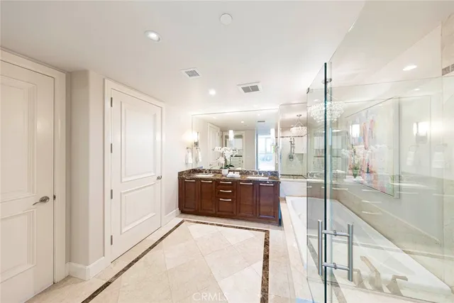a large bathroom with a large tub and shower